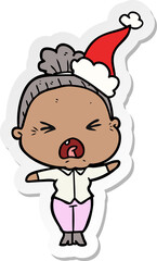sticker cartoon of a angry old woman wearing santa hat