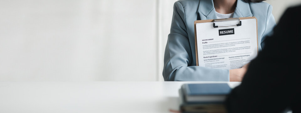 Person submitting resume to interview for a job with a company, Person attending a job interview with a manager to be recruited to the company for the position applied for. Job application concept.