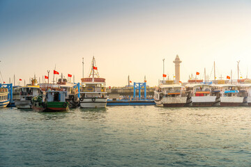 Fototapeta premium Port of the Halong city where many touristic boat start journeys over the Halong bay which is UNESCO World heritage