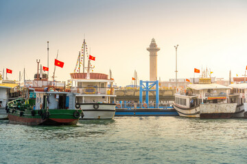 Fototapeta premium Port of the Halong city where many touristic boat start journeys over the Halong bay which is UNESCO World heritage