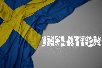 waving colorful national flag of sweden on a gray background with broken text inflation. 3d illustration