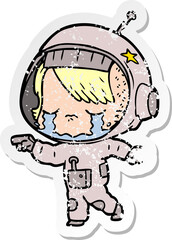 distressed sticker of a cartoon crying astronaut girl