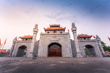 Main gate of Hung King Temple, Phu Tho Province, Vietnam. Text on gate in English meaning Hung King...
