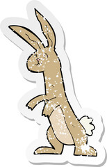 retro distressed sticker of a cartoon rabbit