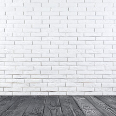 Room with white brick wall and wooden floor