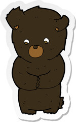 sticker of a cute cartoon black bear