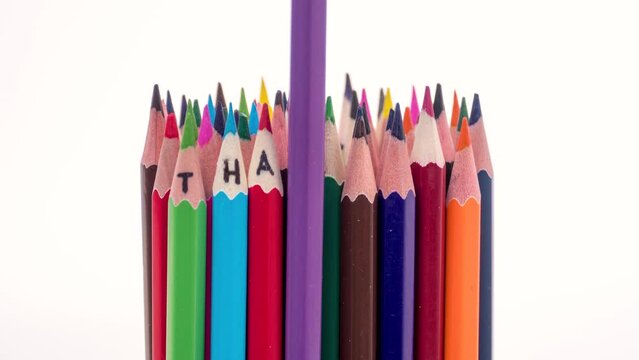 Crayons with the inscription thank you are moving on a white background, stop motion HD animation