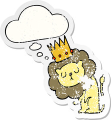 cartoon lion with crown and thought bubble as a distressed worn sticker