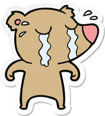sticker of a cartoon crying bear