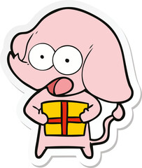 sticker of a cute cartoon elephant with christmas present