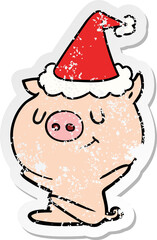 happy distressed sticker cartoon of a pig wearing santa hat