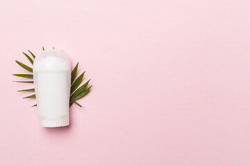 Natural deodorant on color background, top view