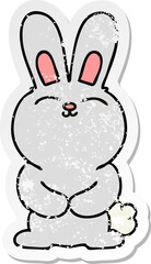 distressed sticker of a quirky hand drawn cartoon rabbit
