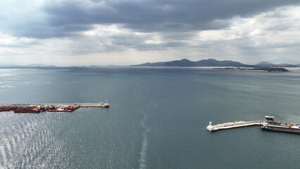 Aerial drone photo from busy port of Piraeus where passenger ships travel to Aegean destination islands, Attica, Greece