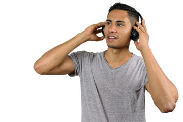 28 year old Brazilian with both hands holding wireless headphone, listening to music and looking at the horizon.