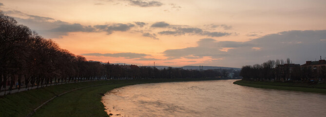river embankment at sunrise. longest linden alley in europe. popular travel destination of ukraine