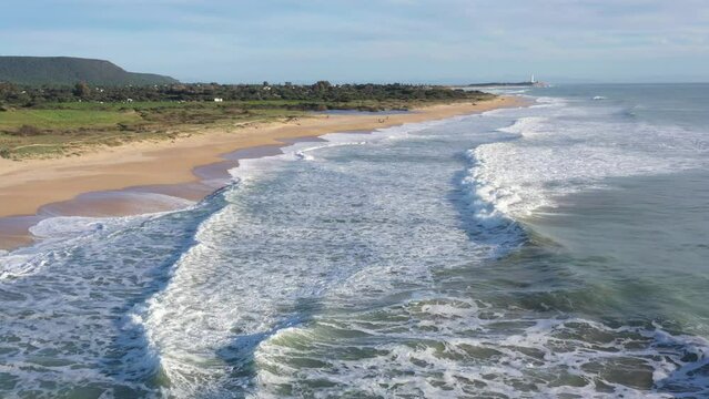 Drone footage of Atlantic waves in south Spain breaking next to the beach in El Palmar, Cadiz