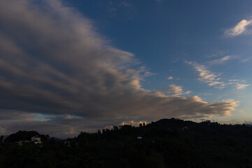 clouds touching the mountain, horizontal scenery 
