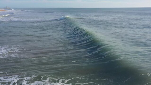 Drone footage of Atlantic waves in south Spain breaking next to the beach in El Palmar, Cadiz