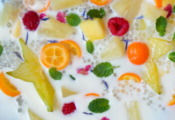 Background of fruit salad with coconut milk and tapioca pearls