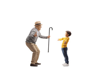 Boy meeting an elderly man with arms wide open