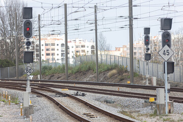 Railway tracks and traffic lights controlling traffic