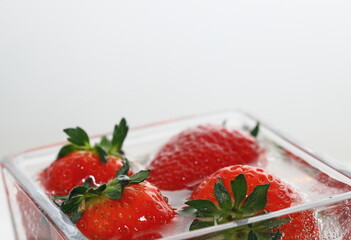 strawberries in a  glass, strawberries in water, air bubbles, delicious dessert, breakfast, vegan, vitamins, strawberry juice