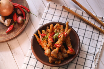 Ceker mercon or claw fireworks a food made from chicken claws cooked with chilies, onions and...