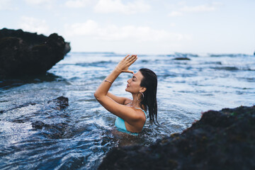 Calm woman with closed eyes in sea