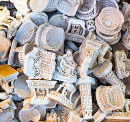 Showcase of different souvenirs for sale at the market in Rome. Refrigerator magnets are very...