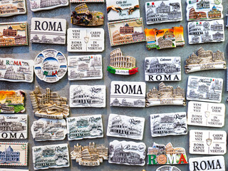 Showcase of different souvenirs for sale at the market in Rome. Refrigerator magnets are very popular souvenirs and are sold in markets around the world. World travel concept
