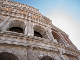 Obraz premium External view of the monumental three-story Colosseum in Rome. The Colosseum is the reference point for tourists visiting this wonderful city