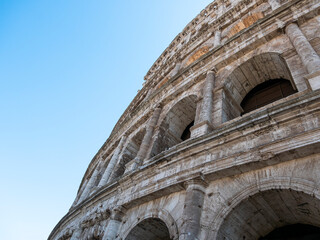 Fototapeta premium External view of the monumental three-story Colosseum in Rome. The Colosseum is the reference point for tourists visiting this wonderful city