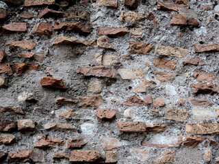 Ancient brick wall background. Colosseo vintage wall. Texture of old amphitheater stone useful for design.