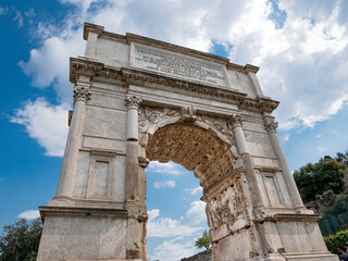 Fototapeta na wymiar The iconic Arch of Titus on the Via Sacra in the Roman Forum