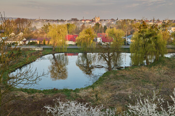 Fototapeta na wymiar View of the pond and the panorama of the city of Krasnystaw from above