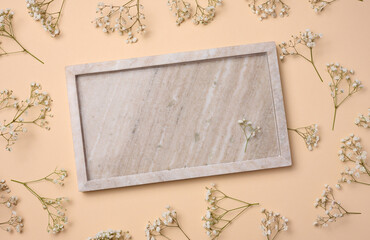 Empty square plate on beige background, top view
