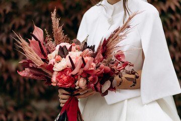 Wedding. The bride's bouquet. Wedding bouquet . A bouquet of red flowers