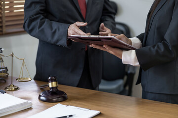 lawyer or judge counselor reading a important legal contract documents in office..