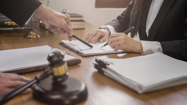 lawyer or judge counselor reading a important legal contract documents in office..