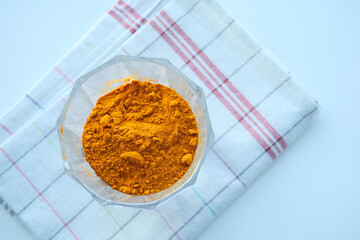  turmeric root powder in a bowl 