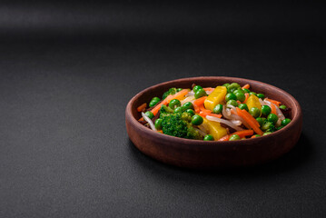 Delicious steamed vegetables broccoli, mushrooms, peas, carrots and onions