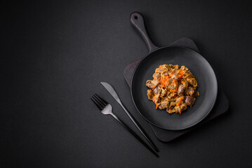 Delicious stewed chicken gizzards with carrots and tomato