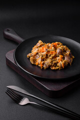Delicious stewed chicken gizzards with carrots and tomato