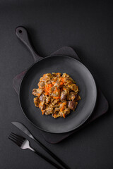 Delicious stewed chicken gizzards with carrots and tomato