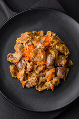 Delicious stewed chicken gizzards with carrots and tomato