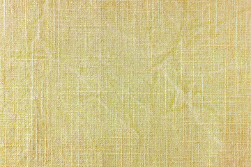 Natural yellow linen fabric texture background. Flax cloth surface, tablecloth, upholstery,...