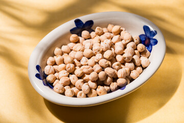 plate of dried chickpeas on the table, top view