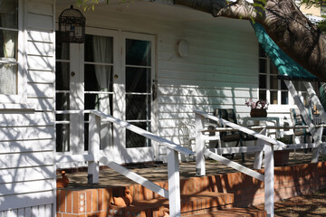 Part of the facade of an old wooden house with a verandah on a sunny day, Queensland, Australia