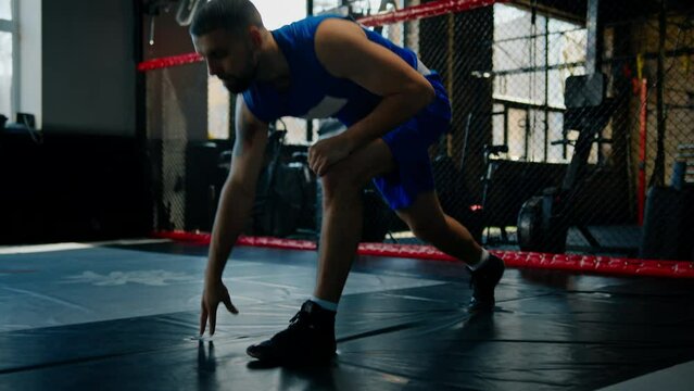 Male boxer training fit man doing boxing in gym young man doing warm up stretching muscles